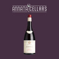 Barolo Riserva wine bottle with cream label and red cap