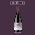 Wine bottle with burgundy foil neck and pale label reading L'Abeuradou Minervois