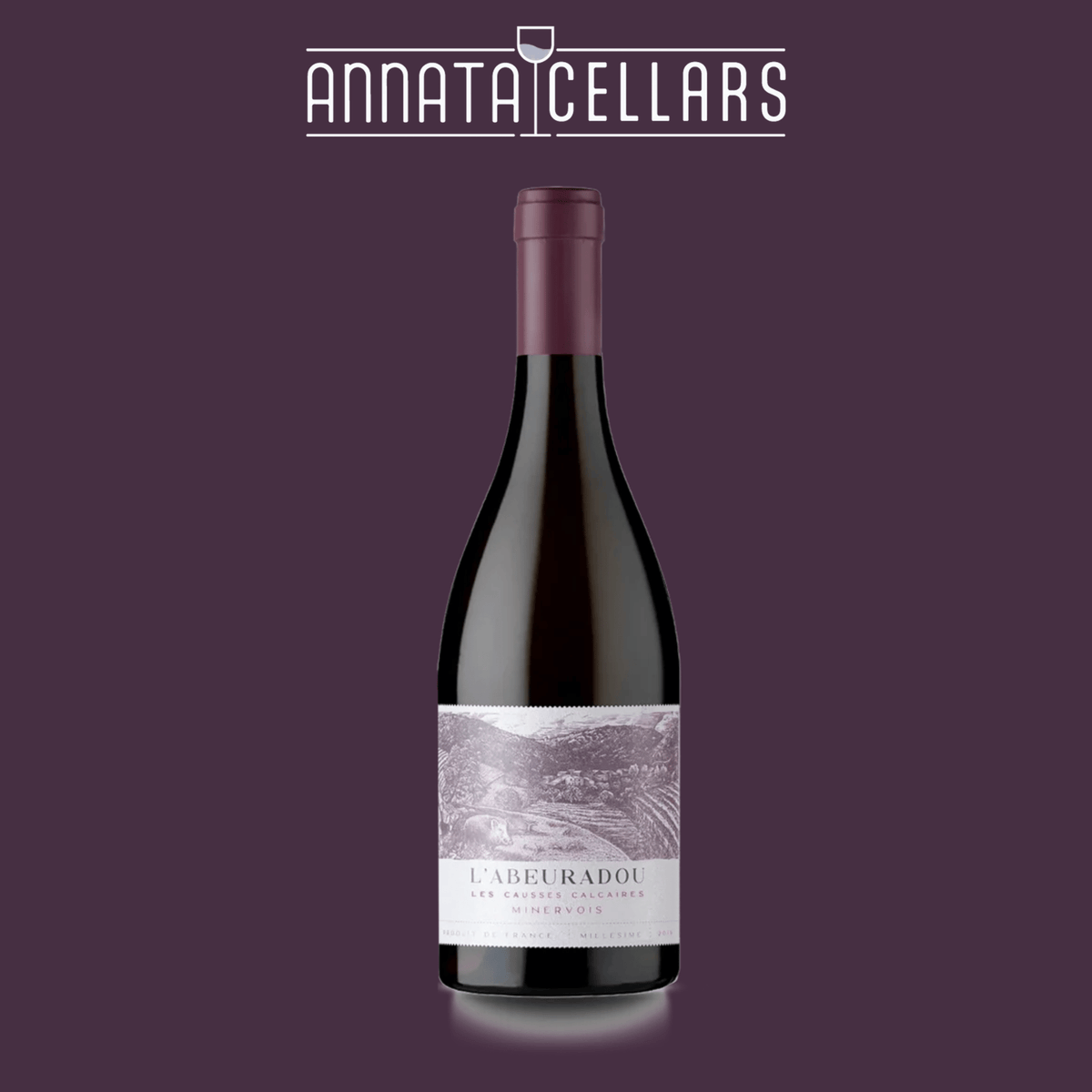 Wine bottle with burgundy foil neck and pale label reading L'Abeuradou Minervois