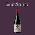 Red wine bottle with red cap and cream label