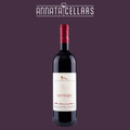 Red wine bottle with black glass, white label, and red foil cap