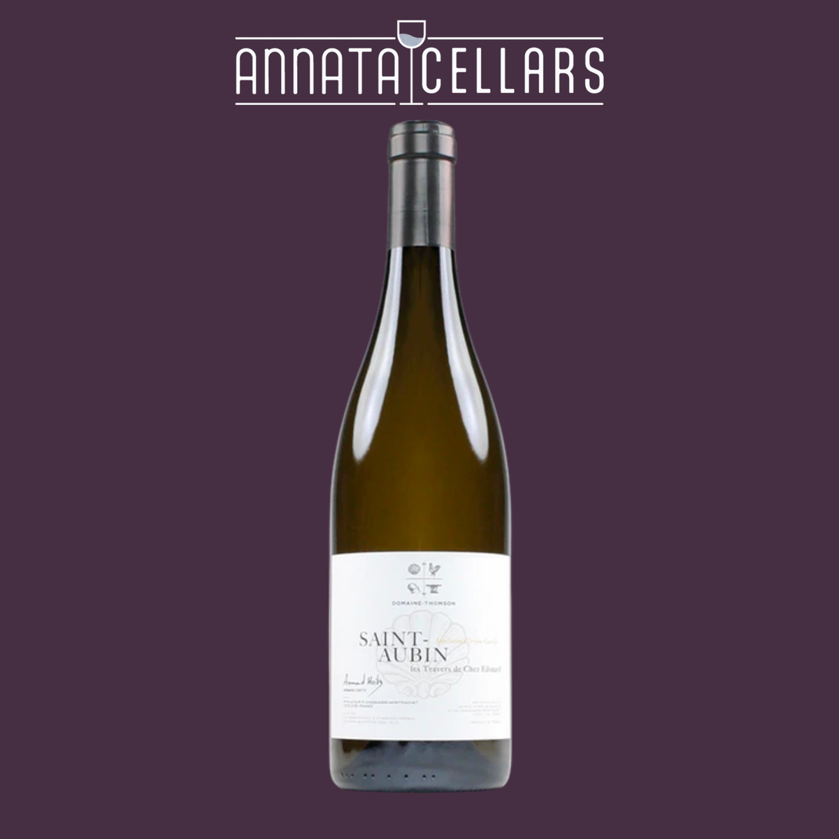 2021 St-Aubin white wine bottle with silver foil capsule and gold liquid