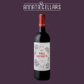 Red wine bottle with dark glass, red foil neck, and illustrated label