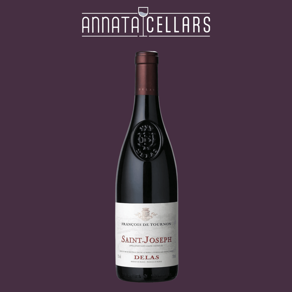 Wine bottle with dark glass and label reading Saint-Joseph and Delas Freres