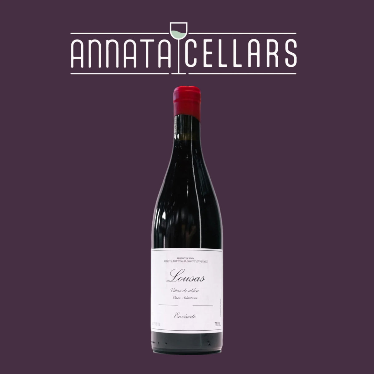 Wine bottle with dark glass, red cap, and white label marked Lousas