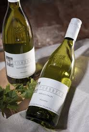Torbreck Marsanne wine bottle on table with another bottle and glass nearby