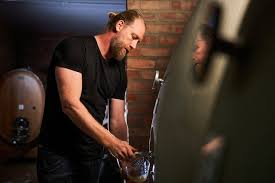 2023 Rall Grenache Blanc wine bottle being poured, glass visible