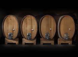 Barbaresco wine aging barrels on a wooden rack